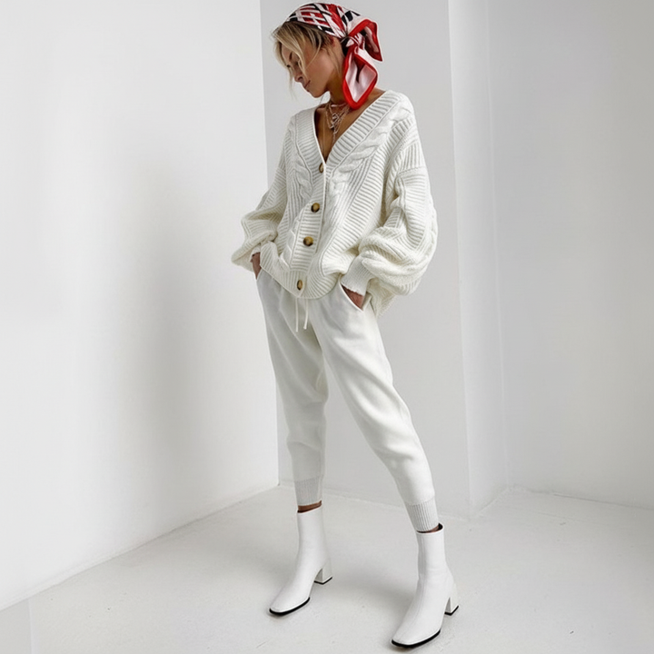 Fashionable women's ribbed knit cardigan with classic button-down front, suitable for various outfits.