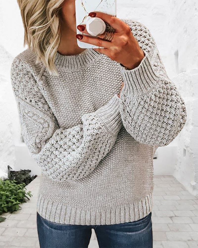 Classic women's pullover sweater, versatile for casual wear. Soft, comfortable, and timeless long sleeve design.