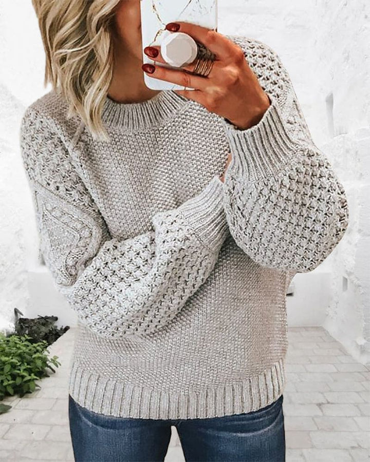 Classic women's pullover sweater, versatile for casual wear. Soft, comfortable, and timeless long sleeve design.