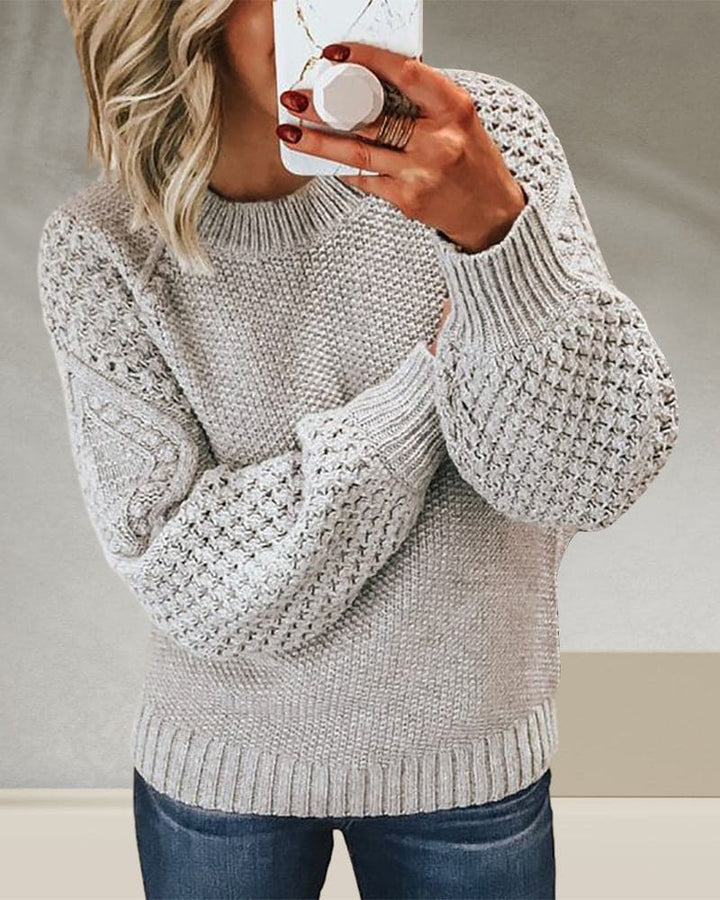Comfortable women's long sleeve pullover sweater featuring a classic round neck & ribbed knit for timeless style.
