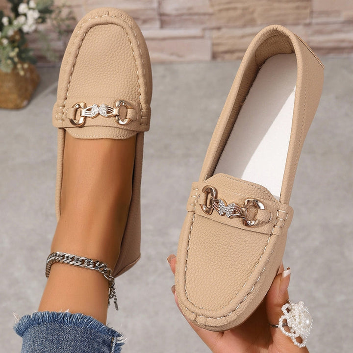Stylish women's slip-on loafers for office wear or casual outings. Elegant round toe design, comfortable footwear.