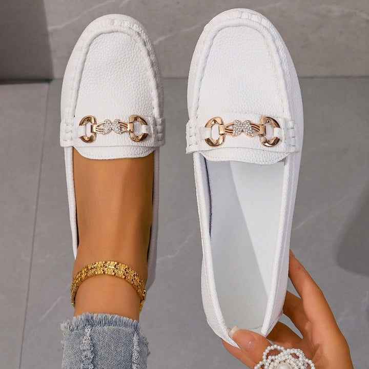 Classic women's slip-on loafers, comfortable round toe design. Stylish footwear for casual & office wear.