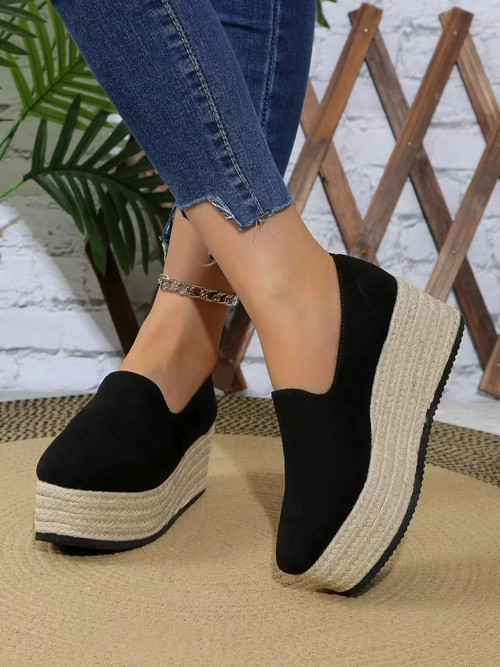 Fashion-forward women's platform slip-ons, featuring a supportive wedge.