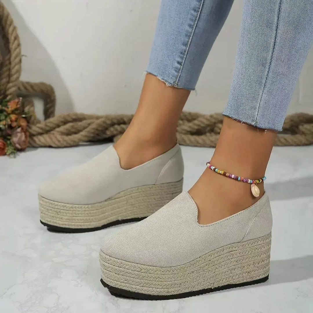 Comfortable women's wedge platform slip-ons for versatile wear.