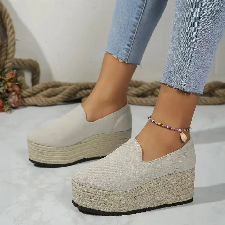 Comfortable women's wedge platform slip-ons for versatile wear.