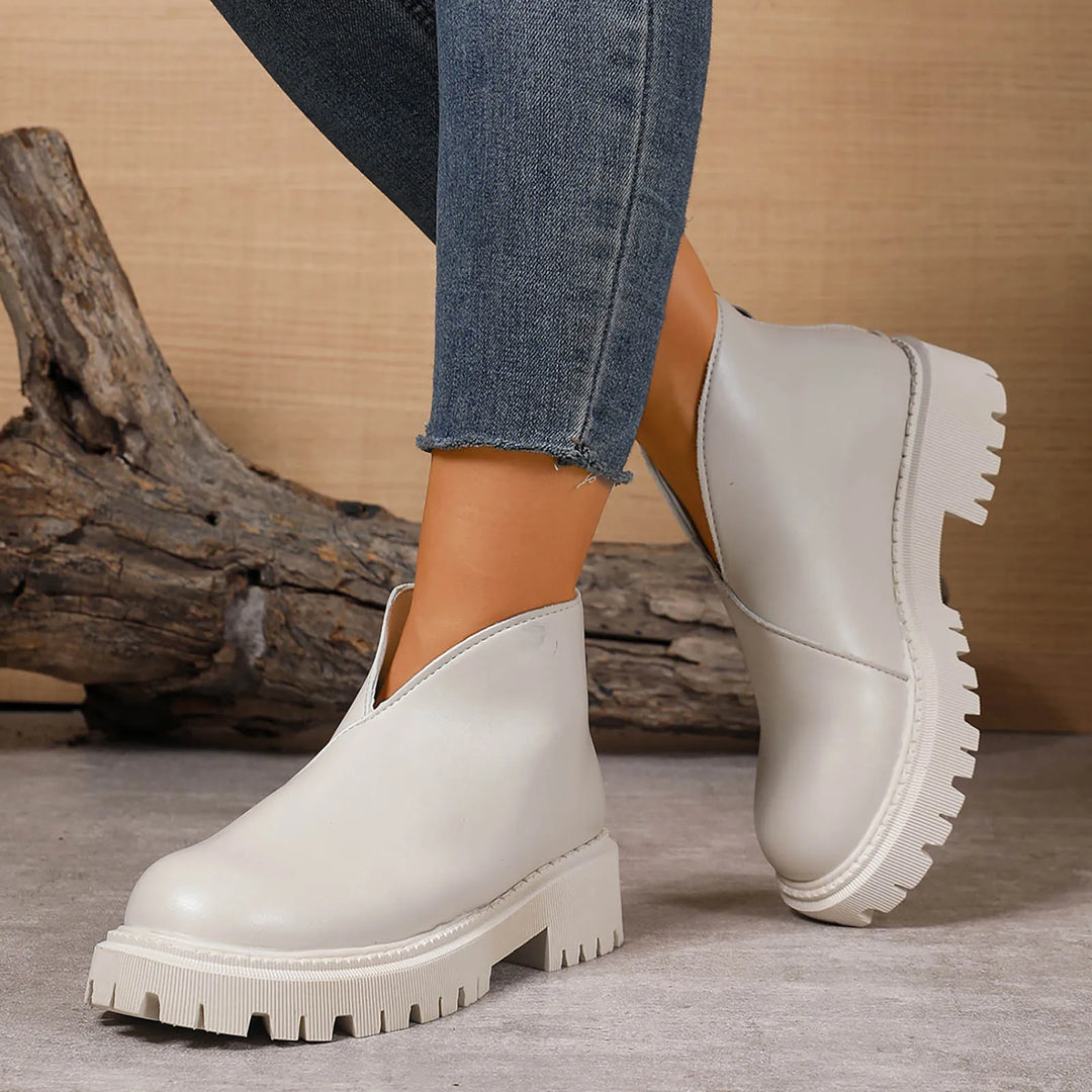 Women's everyday tan leather platform slip-on sandals, combining fashion, comfort, and easy wear.