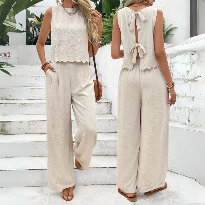 Women's comfortable two-piece lounge set, perfect for casual summer wear with sleeveless top & elastic waist shorts.