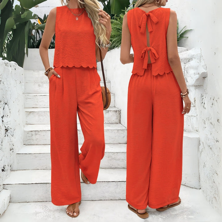 Casual women's two-piece lounge set. Comfortable sleeveless top & elastic waist shorts, a stylish summer outfit.