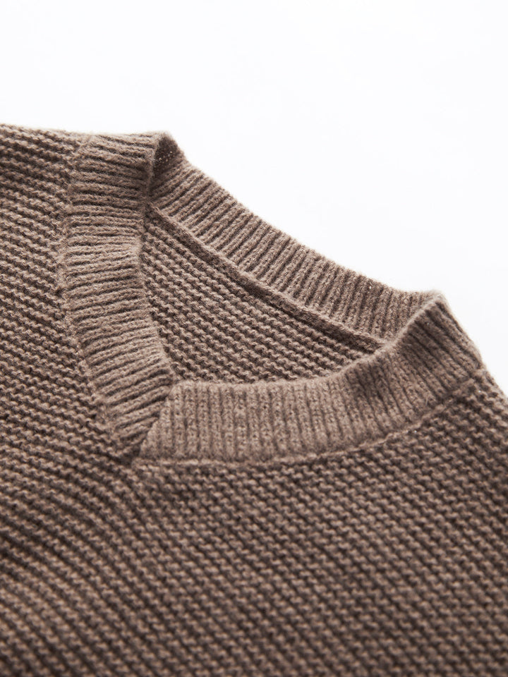 Versatile women's V-neck pullover. Chic knit sweater, designed for comfortable wear and everyday style.