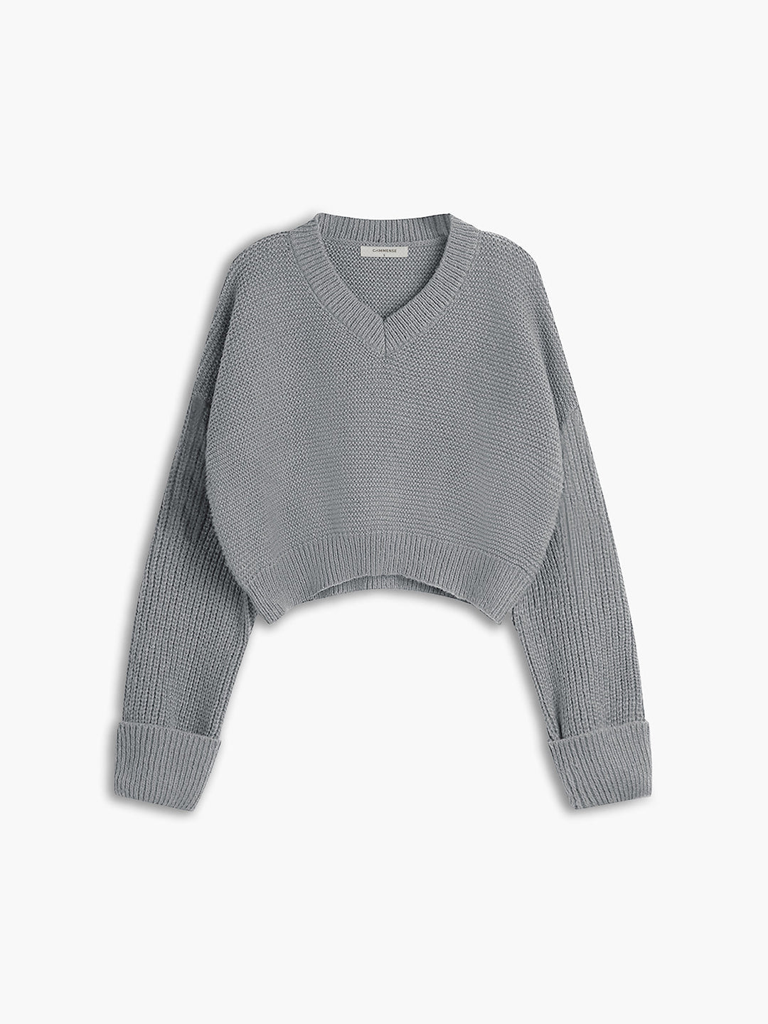 Casual knit V-neck sweater for women. A stylish pullover offering comfortable wear and a versatile everyday look.