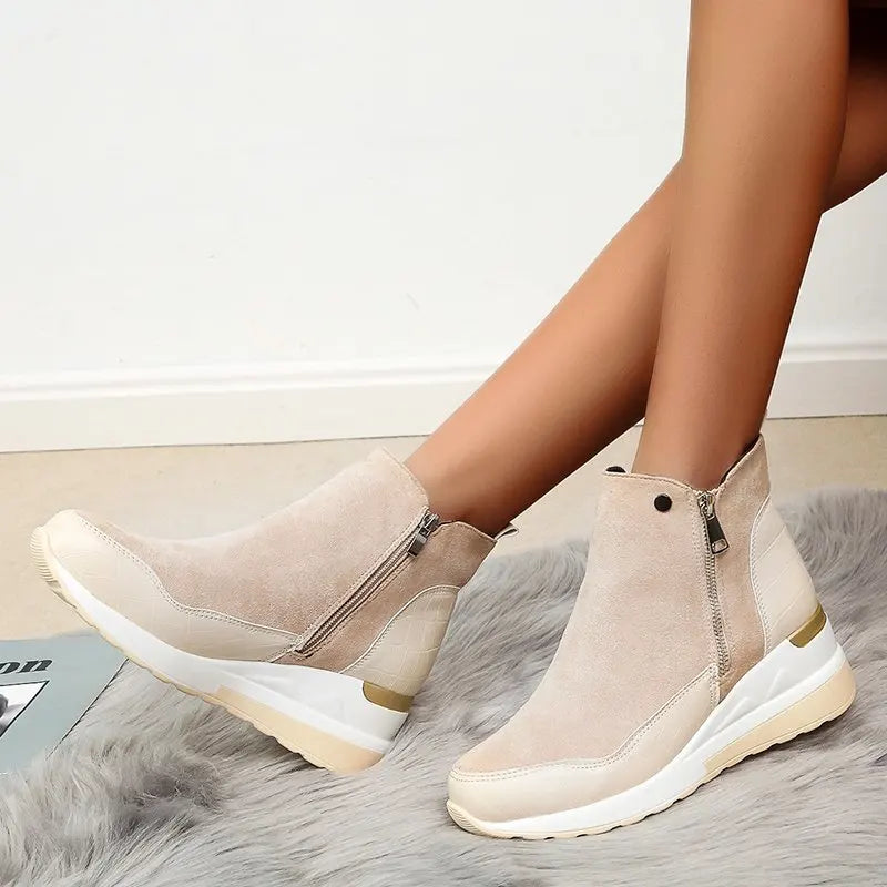 Stylish women's wedge ankle boots, perfect for fall and winter. Zippered casual ladies boots with comfort.