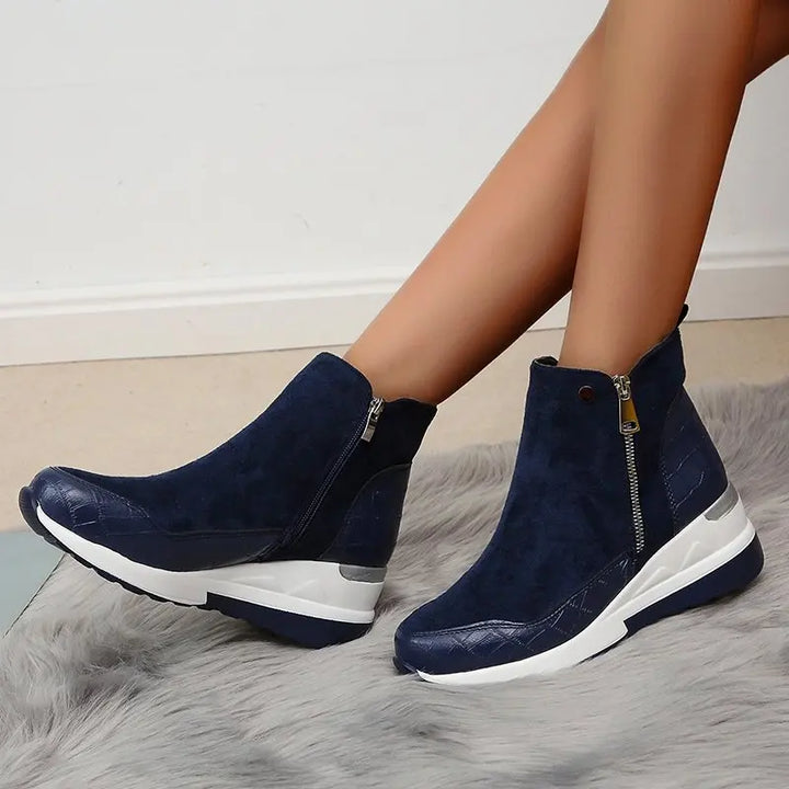 Fashionable ladies' wedge ankle boots. Stylish and comfortable footwear, ideal for fall & winter casual outfits.