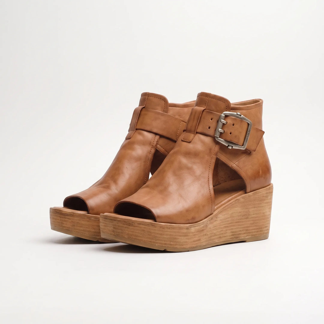 Elevated summer style with these comfortable women's wedge sandals. Peep toe & platform design for fashionable footwear.