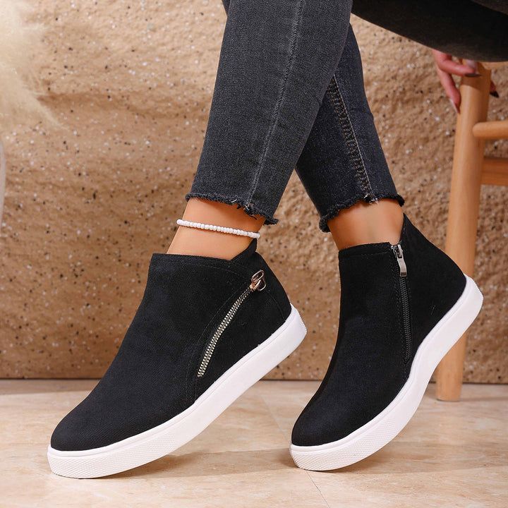 Easy on/off women's walking shoes featuring a convenient zip closure and orthopedic support.