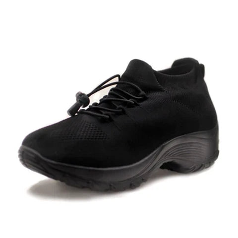 Woman trying on ComfortEase orthopedic comfort shoes, ensuring a perfect fit for all-day support.