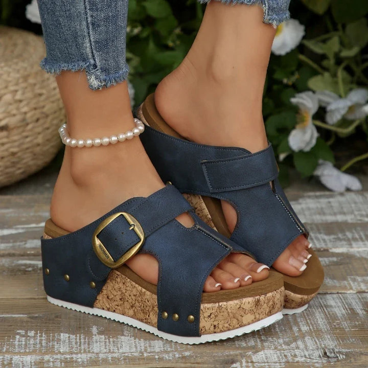 Supportive women's casual buckle slides with orthopedic arch support, open toe flat design for comfort.