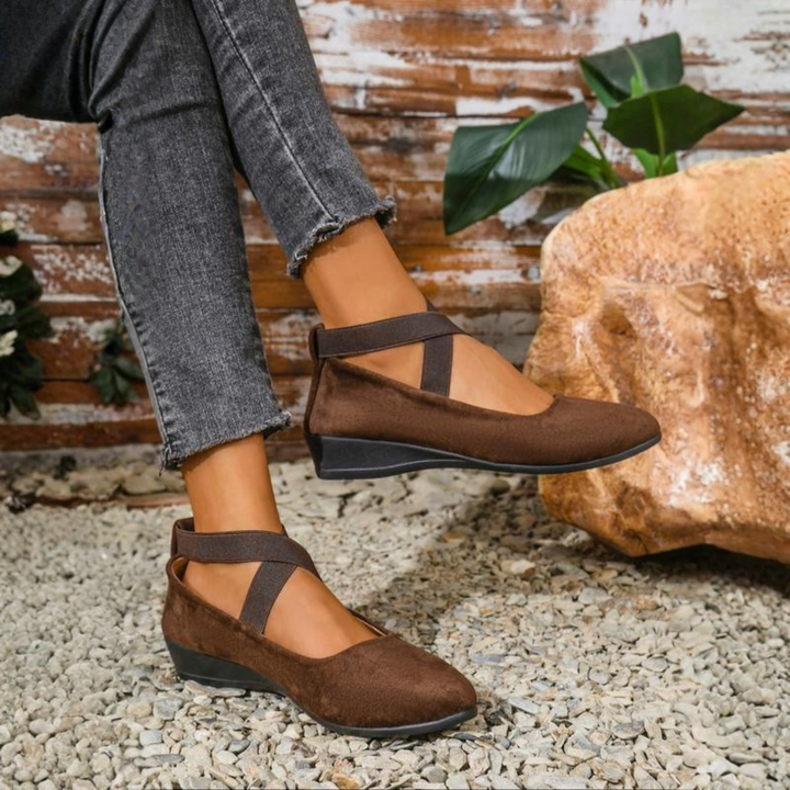 Fashionable women's closed-toe slip-on wedge shoes, offering a sleek look & comfortable lift for versatile styling.