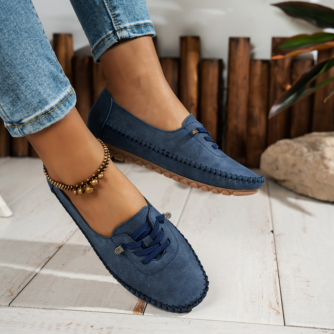Side view: Women's slip-on walking shoes, highlighting arch support & cushioning for sensitive feet comfort.