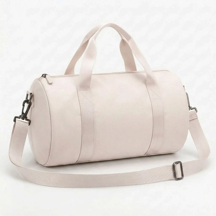 Durable women's gym duffel, compact and water-resistant nylon, for active daily use.