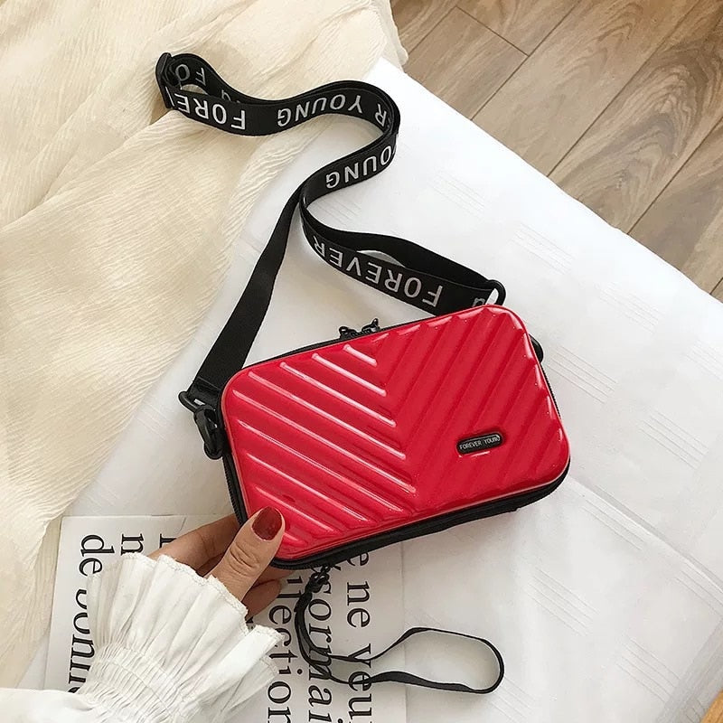 Lightweight hard shell crossbody bag for women. Protective vegan leather, perfect for travel & daily.