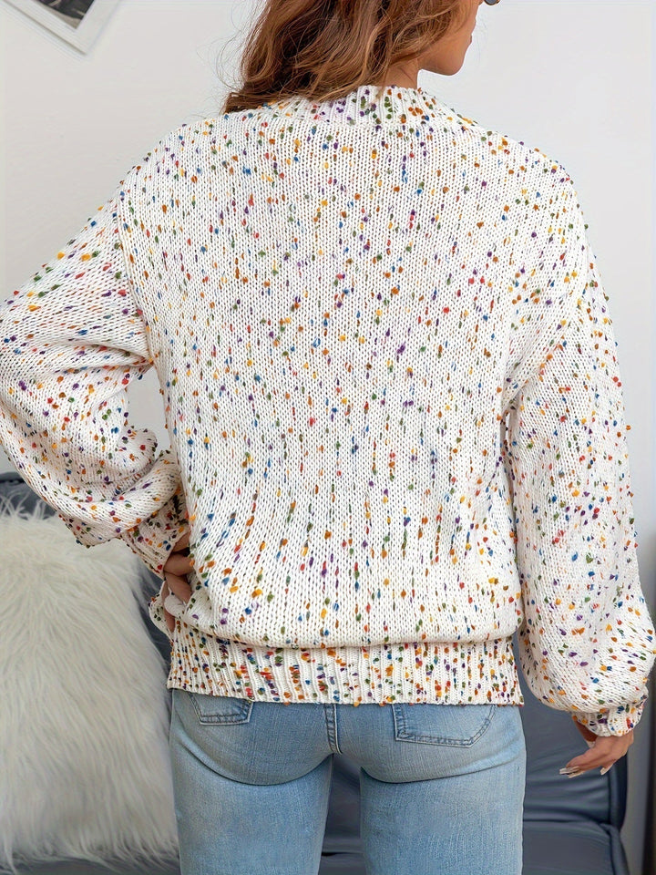 Women's confetti knit round neck sweater, folded neatly to show the cozy acrylic wool and fun, stylish print.