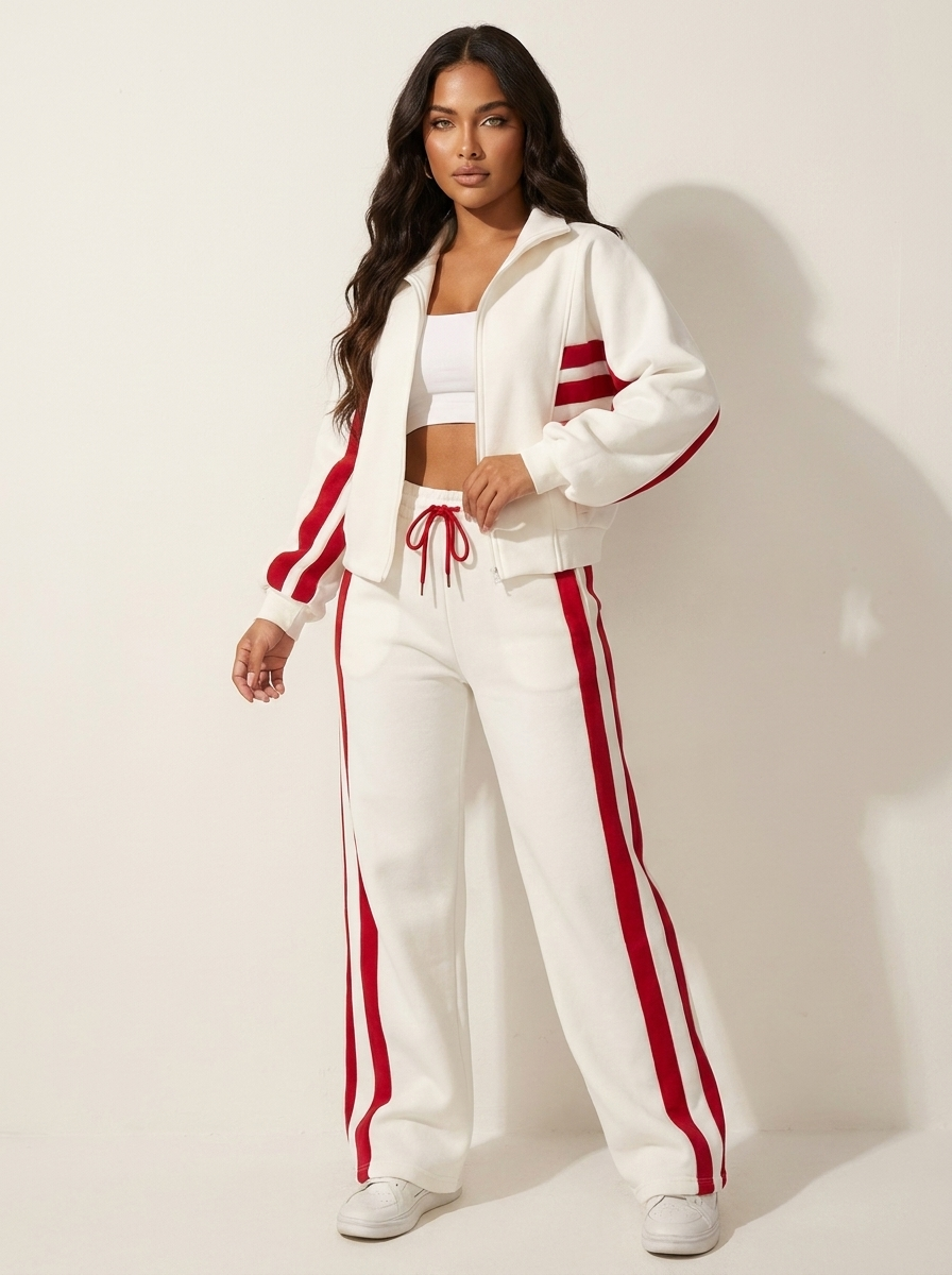 Front view of women's zip-up tracksuit jacket with contrast stripes, ideal for casual wear or active use.