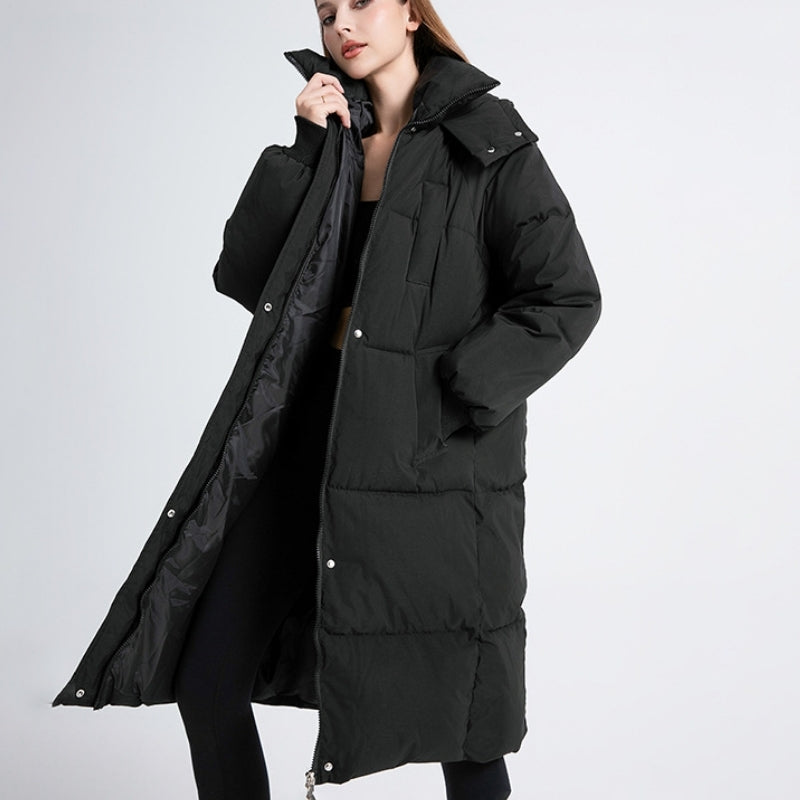 Women's Cortina long puffer jacket in black, ideal for cold weather & winter fashion. Stylish, warm & water-resistant outerwear.
