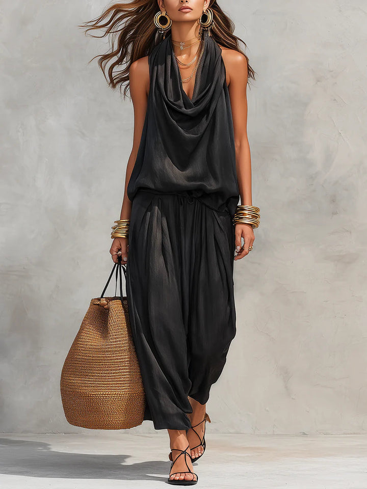 Women's cowl neck halter top & draped wide leg pant two-piece set. Flowy resort wear for summer evenings.