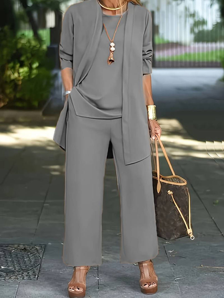 Versatile women's matching set: round neck long sleeve top, wide leg pants, and a camisole for stylish lounging.