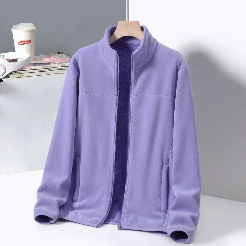 Women's Cozy Aspen Ridge Jacket, perfect for winter comfort. Features a high neck & zippered pockets.