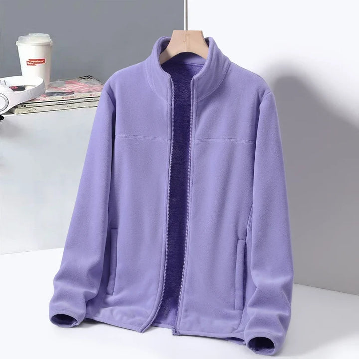 Women's Cozy Aspen Ridge Jacket, perfect for winter comfort. Features a high neck & zippered pockets.