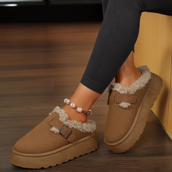 Women's supportive slip-on clogs with cozy lining and buckle detail. Comfortable casual footwear for women's fashion.