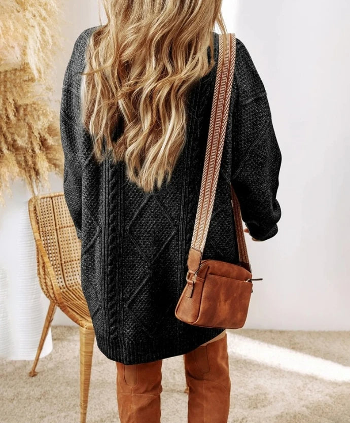 Super cozy women's oversized cable knit sweater dress, a chic long-sleeve fall fashion piece.
