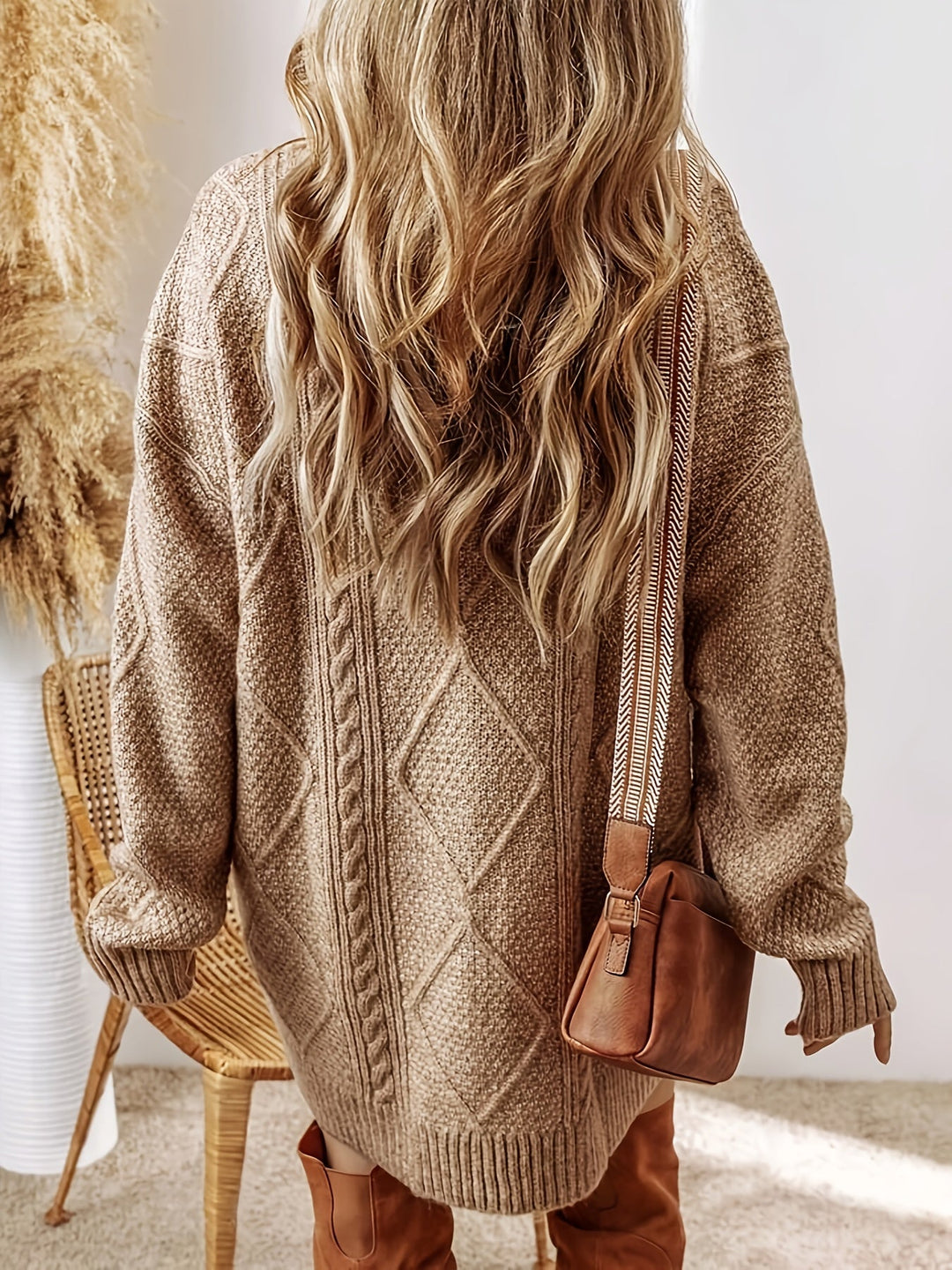 Chic long-sleeve oversized cable knit sweater dress for women, casual yet stylish.