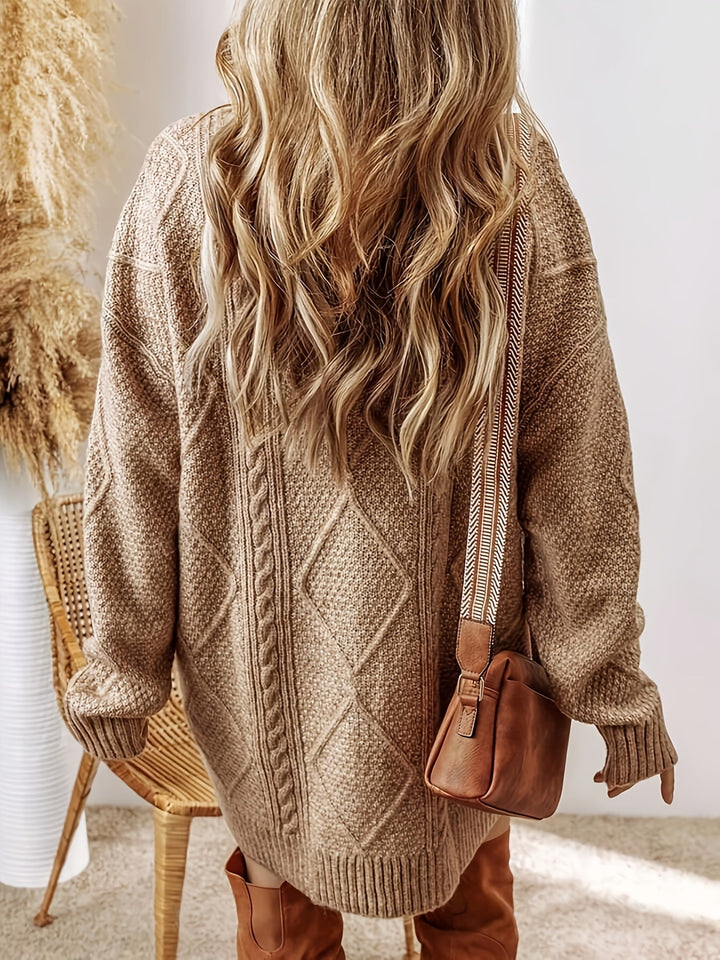 Chic long-sleeve oversized cable knit sweater dress for women, casual yet stylish.