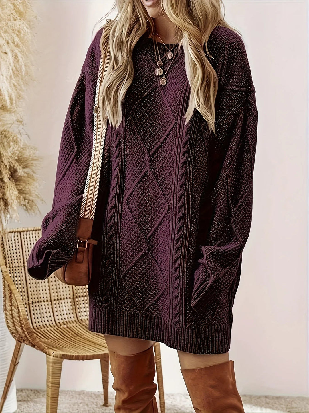 Soft cable knit oversized sweater dress for women, a comfortable long-sleeve winter staple.