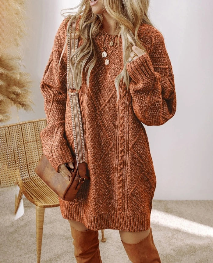 Elegant women's long-sleeve oversized cable knit sweater dress, a cozy fall fashion essential.