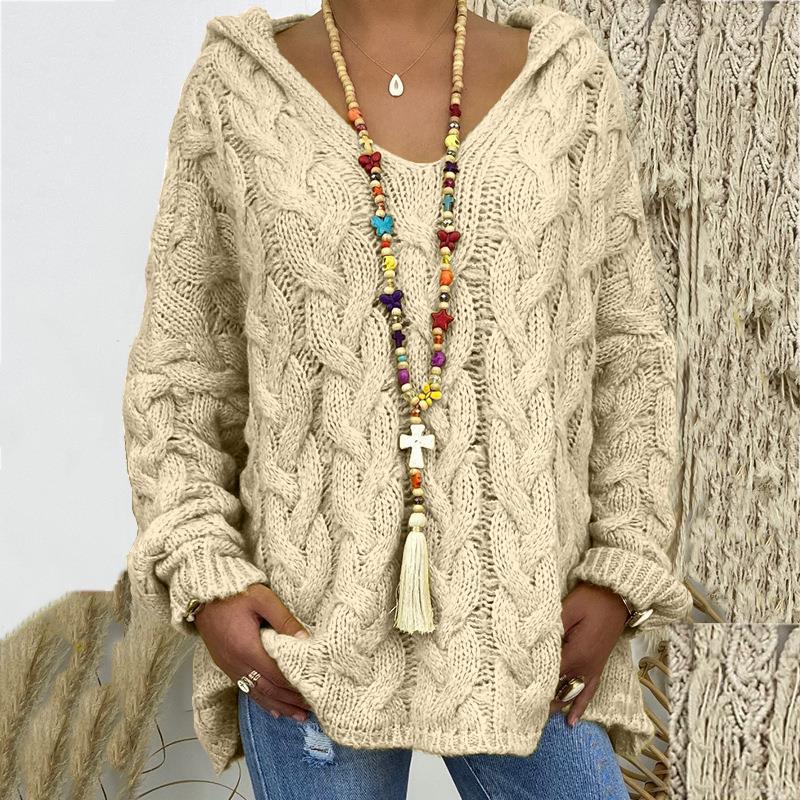 Versatile women's cable knit sweater, ideal for comfortable winter fashion and a relaxed fit.