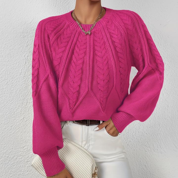 Women's stylish cable knit sweater with lantern sleeves, ideal for cozy autumn winter outfits
