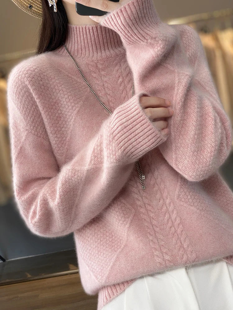Warm women's turtleneck sweater with intricate cable knit texture, designed for cozy winter comfort.