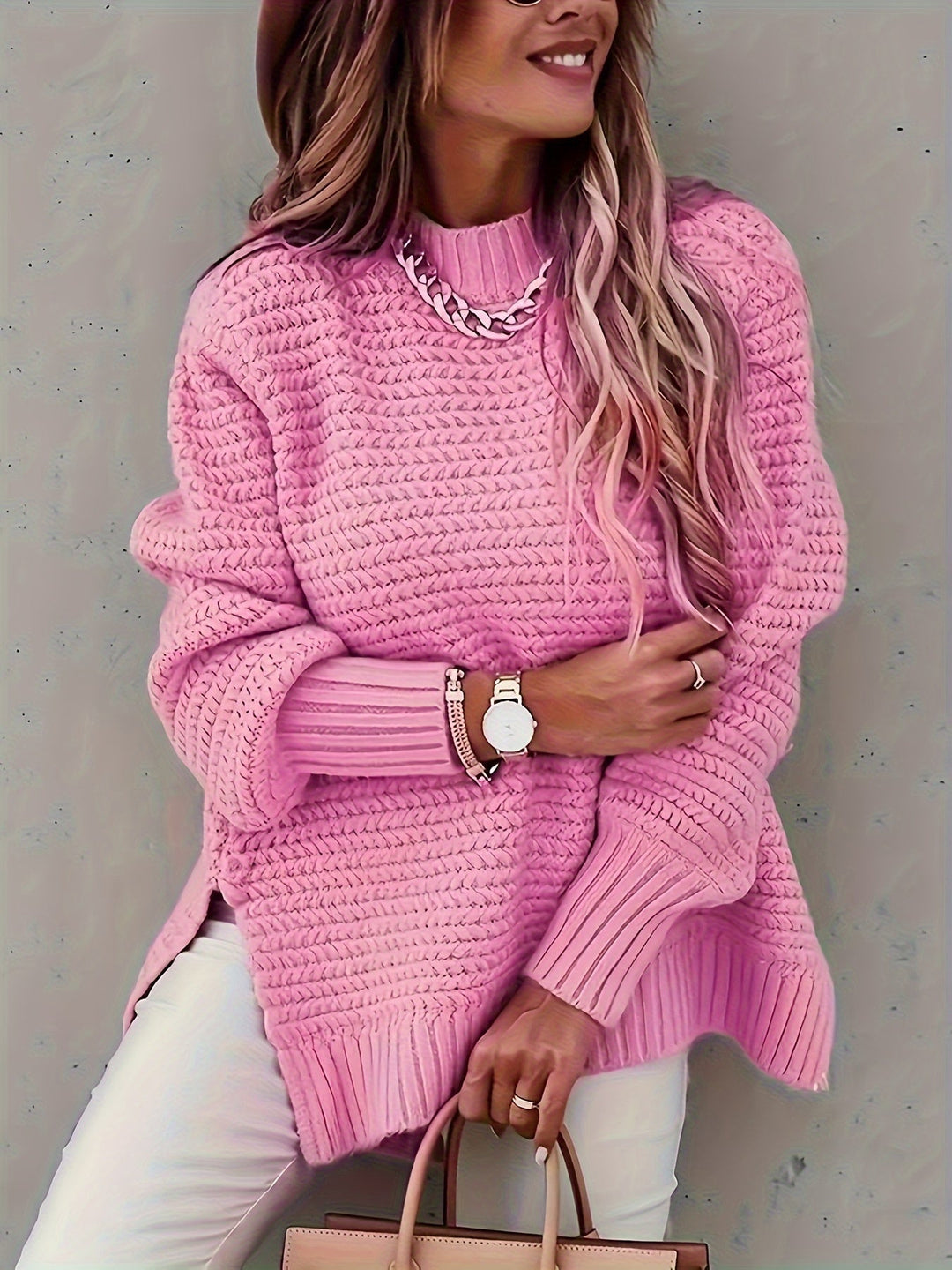 Woman wearing a relaxed fit chunky knit pullover sweater, showcasing cozy winter fashion.