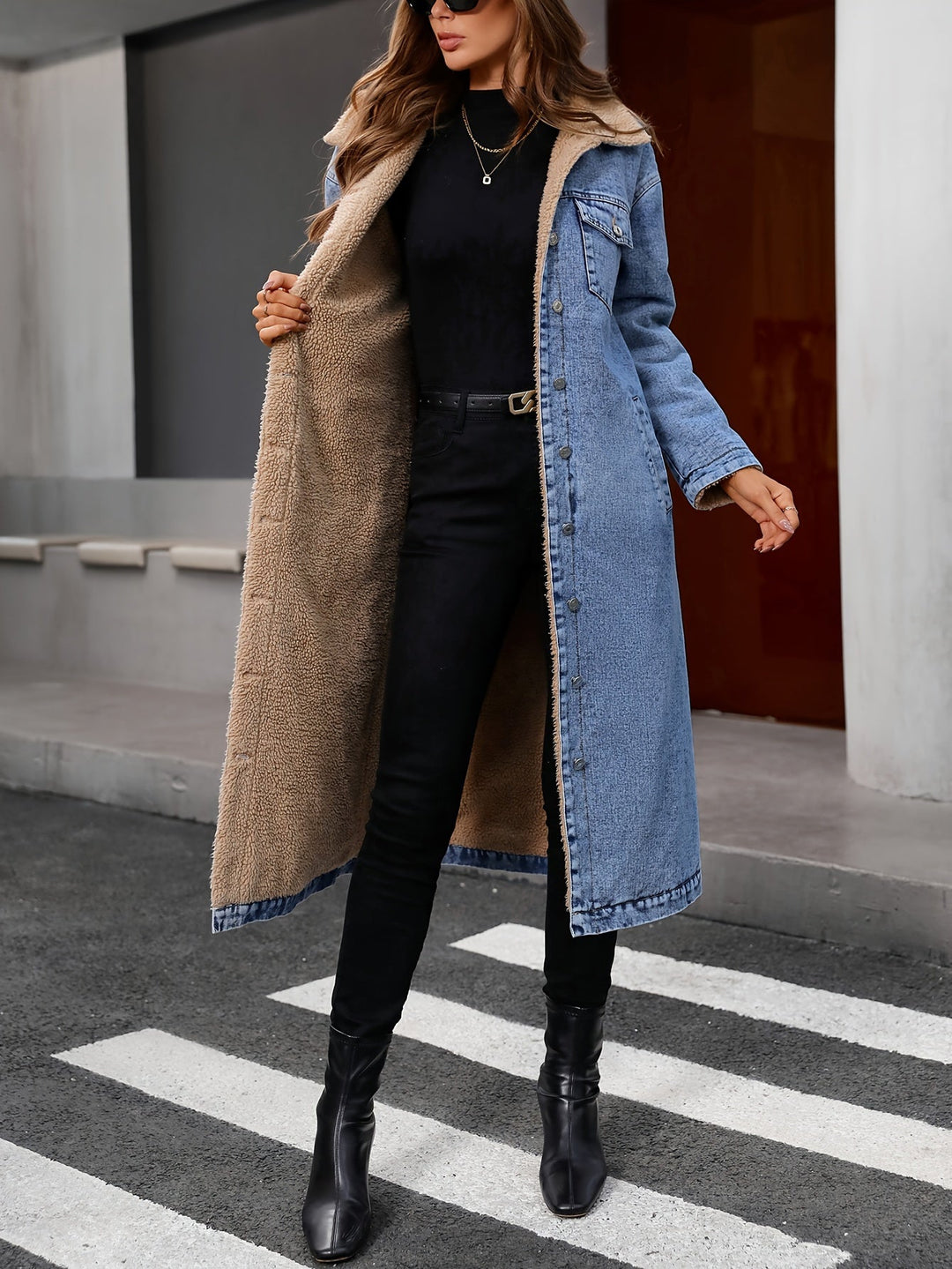Stylish women's cropped denim jacket in washed blue, a versatile outerwear piece for fall and winter layering.
