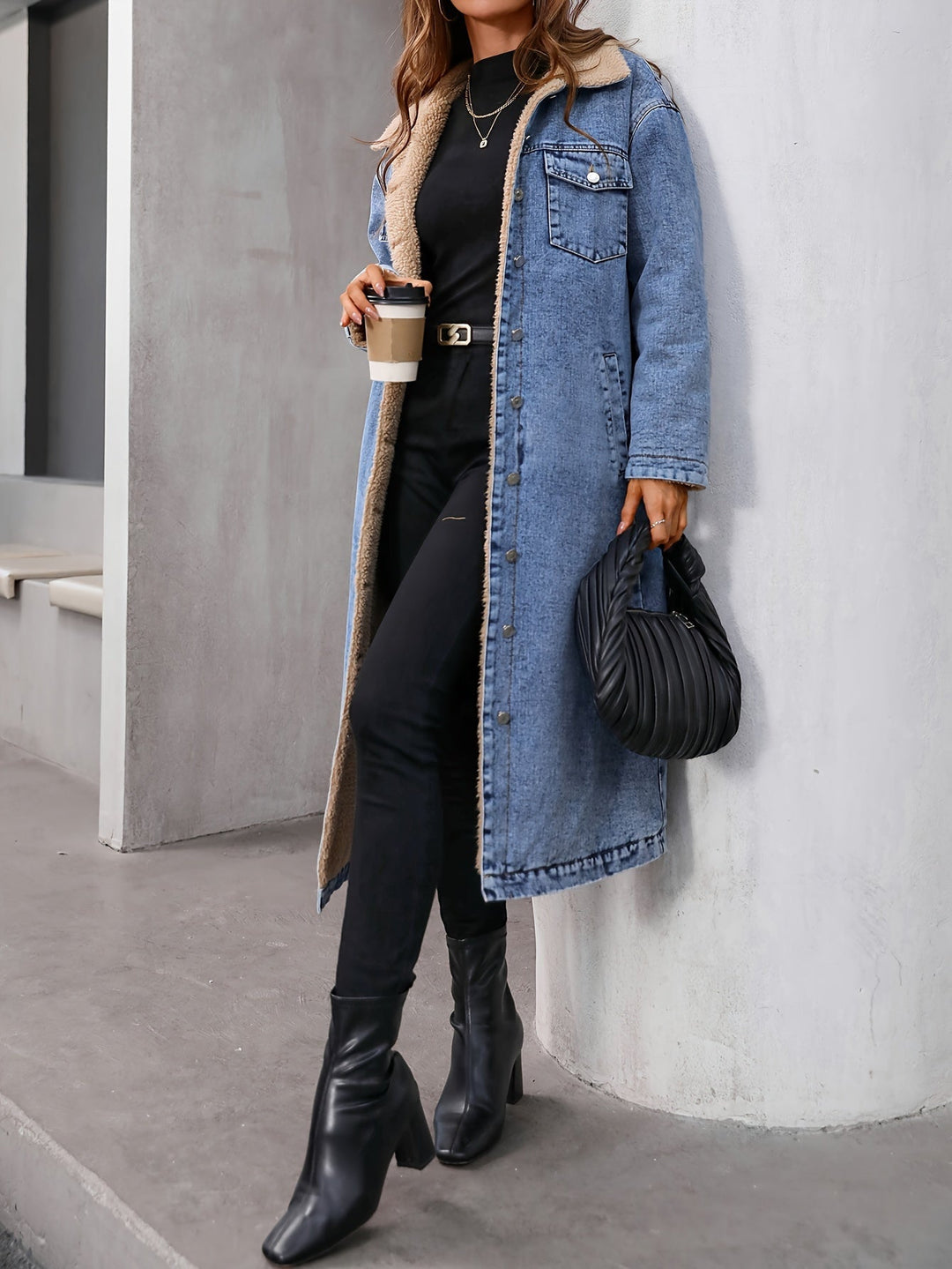 Fashionable women's cropped blue denim jacket, an essential layering piece for chilly fall & winter outfits.