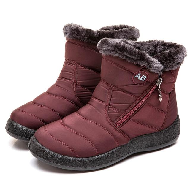 Ankle-height women's winter boots offering support & cozy comfort for cold weather exploration.