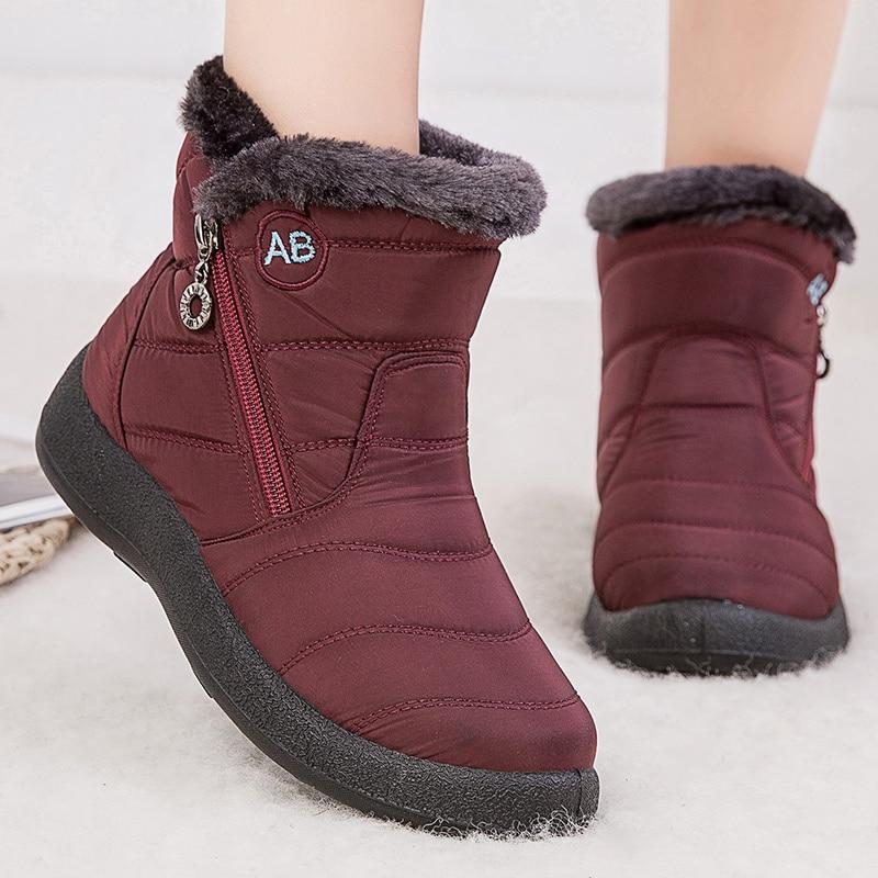 Close-up of durable, waterproof material on women's winter boots, ideal for cold weather.