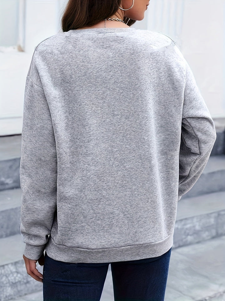 Cozy women's feather print long sleeve sweatshirt. Stylish pullover for casual winter outfits.