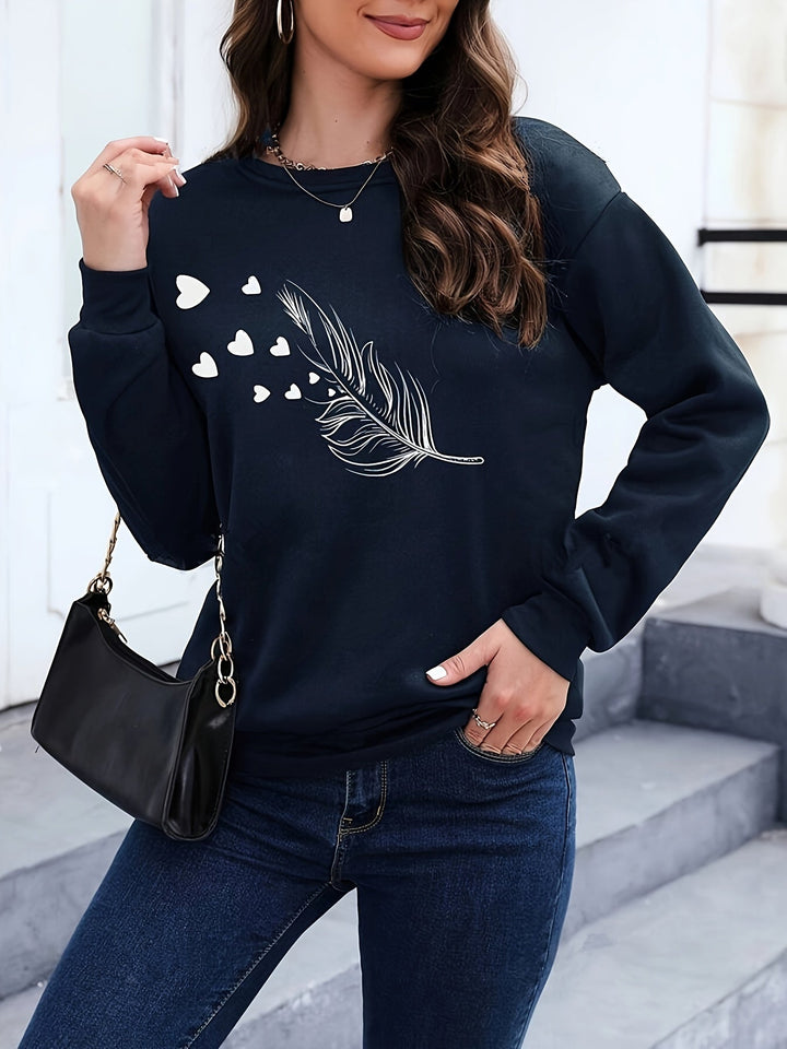 Women's stylish feather print casual pullover. Long sleeve sweatshirt for cozy autumn and winter fashion.