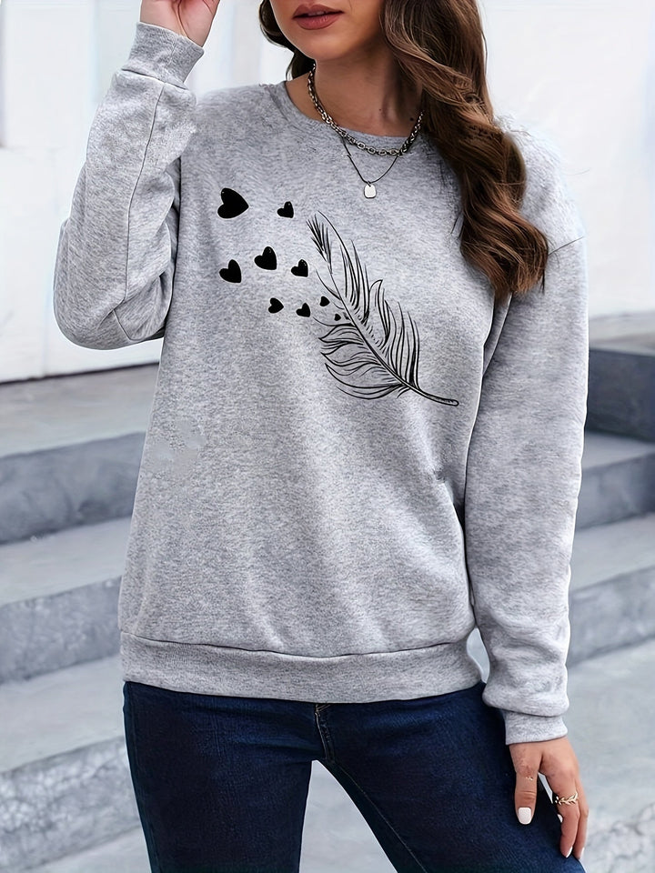 Soft women's feather print casual sweatshirt. Comfortable long sleeve pullover for chilly autumn days.