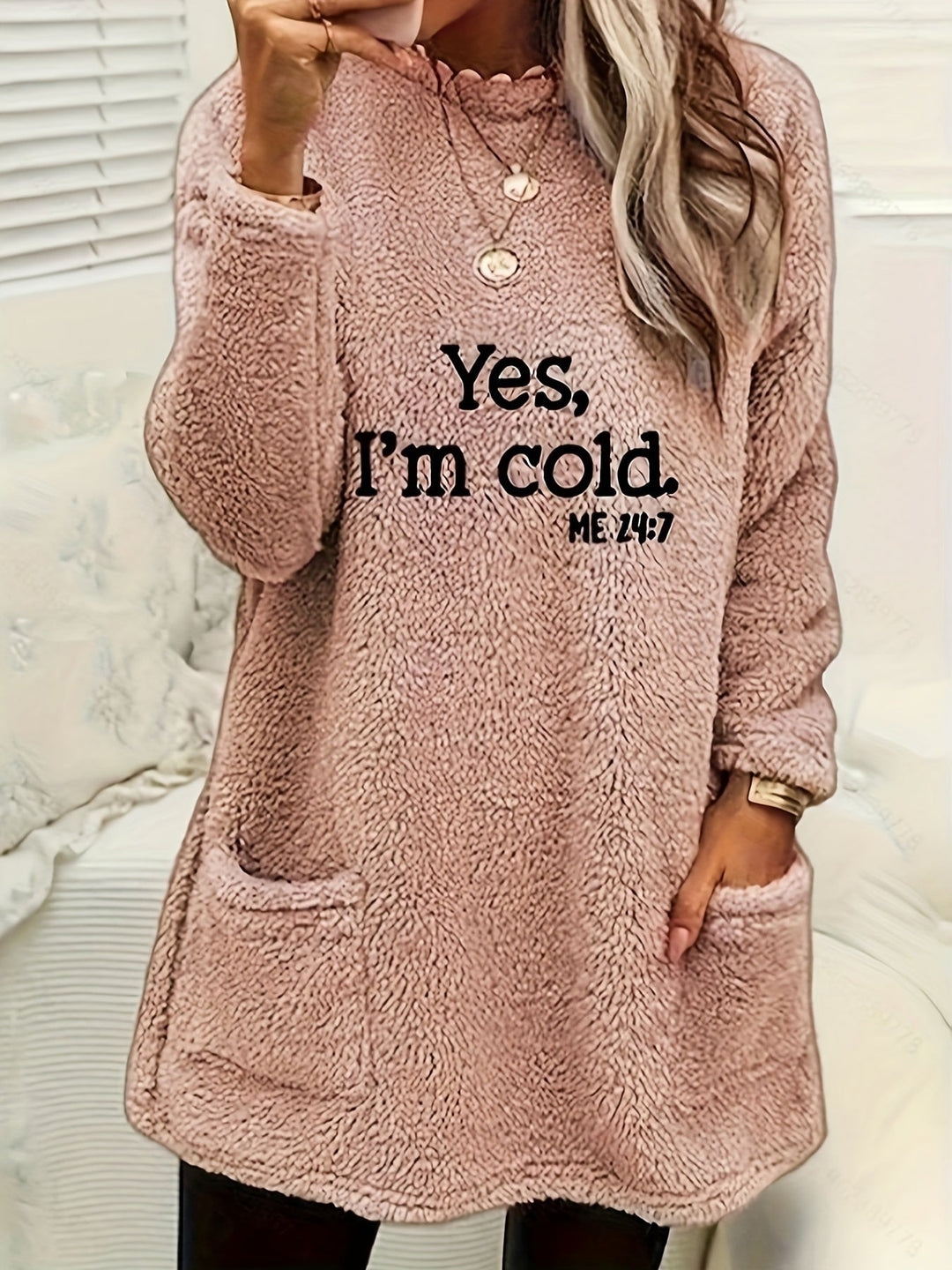 Comfortable women's printed fleece top, ideal for casual wear; features a warm, long-sleeve, crew neck design.