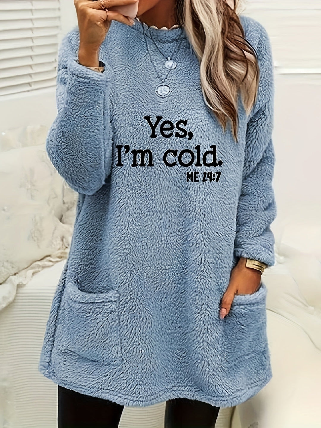 Warm women's fleece crew neck sweater, featuring a fun Luna print; comfortable and cozy for casual winter fashion.